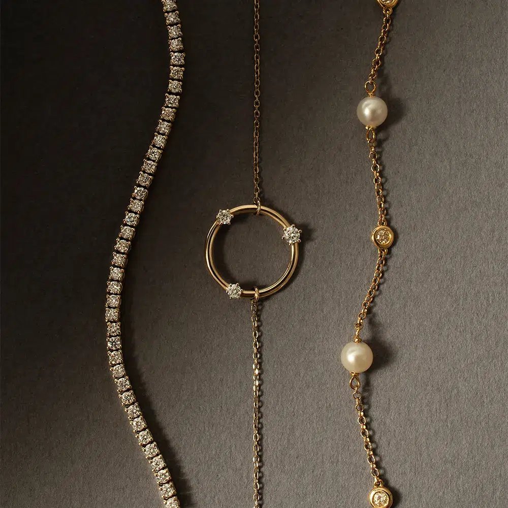 riviera de diamantes e pulseiras com diamantes e pérolas